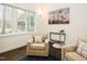 Cozy living room featuring natural light, hardwood floors, and comfortable seating, creating an inviting atmosphere at 104 Manchester Pl, Chapel Hill, NC 27516