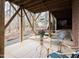 Covered patio with outdoor seating, overlooking a tranquil wooded area at 104 Manchester Pl, Chapel Hill, NC 27516