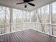 Spacious screened porch with wooden floors and a view of the surrounding woods at 104 Manchester Pl, Chapel Hill, NC 27516