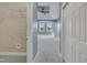 A spacious bedroom featuring a walk-in closet, large windows and a modern ceiling fan at 10421 Rosegate Ct # 303, Raleigh, NC 27617