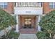 Welcoming entrance with brick walkway, columns, and meticulously maintained landscaping for a great first impression at 10421 Rosegate Ct # 303, Raleigh, NC 27617