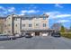 Inviting multi-story condo complex with private garages and ample parking, showcasing a well-maintained exterior at 10421 Rosegate Ct # 303, Raleigh, NC 27617