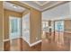 Inviting foyer leading to a spacious living area, featuring hardwood floors, elegant finishes, and plenty of natural light at 10421 Rosegate Ct # 303, Raleigh, NC 27617