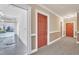 A hallway and garage featuring storage, shelving, and parking at 10421 Rosegate Ct # 303, Raleigh, NC 27617