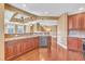 Bright kitchen features stainless steel appliances, granite counters, and hardwood floors at 10421 Rosegate Ct # 303, Raleigh, NC 27617