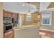 Well-lit kitchen with stainless steel appliances and granite countertops at 10421 Rosegate Ct # 303, Raleigh, NC 27617