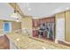 Modern kitchen with granite countertops, stainless steel appliances, and breakfast bar at 10421 Rosegate Ct # 303, Raleigh, NC 27617