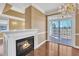 Bright living area features a fireplace, sliding glass doors, and a chandelier at 10421 Rosegate Ct # 303, Raleigh, NC 27617