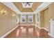 Living room area with large windows and hardwood floors at 10421 Rosegate Ct # 303, Raleigh, NC 27617