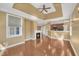 Spacious living area featuring a fireplace, large windows, and hardwood floors at 10421 Rosegate Ct # 303, Raleigh, NC 27617