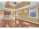 Bright living area featuring a modern kitchen, hardwood floors, and large windows at 10421 Rosegate Ct # 303, Raleigh, NC 27617