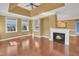 Bright living area with fireplace, hardwood floors, and large windows at 10421 Rosegate Ct # 303, Raleigh, NC 27617