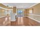 Spacious living area with fireplace, hardwood floors, balcony access, creating an inviting and comfortable atmosphere for relaxation at 10421 Rosegate Ct # 303, Raleigh, NC 27617