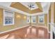 Living room area with large windows and hardwood floors at 10421 Rosegate Ct # 303, Raleigh, NC 27617