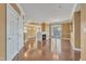 Open living space with a fireplace, hardwood floors, and a stylish chandelier, perfect for modern living and entertaining at 10421 Rosegate Ct # 303, Raleigh, NC 27617