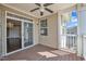 Relaxing covered patio with ceiling fan and sliding door access to living area at 10421 Rosegate Ct # 303, Raleigh, NC 27617