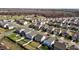 An aerial view showcases a suburban neighborhood with well-maintained lawns, sidewalks, and tree-lined streets at 1055 Kerr St, Burlington, NC 27215