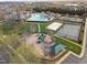 Overhead view of community playground, tennis courts, pool, and clubhouse at 1055 Kerr St, Burlington, NC 27215