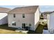 The home's backyard with a patio area, grill, and easy access to the interior through sliding glass doors at 1055 Kerr St, Burlington, NC 27215