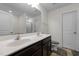 Bright bathroom with a double sink vanity, white cabinets, and a separate shower area, providing ample space at 1055 Kerr St, Burlington, NC 27215