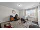 Versatile bonus room with natural light, a desk, and exercise equipment, offering flexibility for various activities at 1055 Kerr St, Burlington, NC 27215