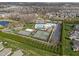 Aerial view showcases community pool, tennis courts, and well-maintained green spaces at 1055 Kerr St, Burlington, NC 27215