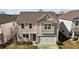Charming two-story home featuring neutral siding, an attached two-car garage, and a cozy front porch at 1055 Kerr St, Burlington, NC 27215