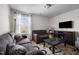 Cozy living room with comfortable sofas, patterned rug and a flat screen TV on a cabinet at 1055 Kerr St, Burlington, NC 27215