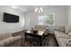 Comfortable living room featuring hardwood floors, ample seating, and abundant natural light at 1055 Kerr St, Burlington, NC 27215