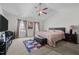 Spacious main bedroom with a tray ceiling, large windows, and neutral tones, creating a peaceful retreat at 1055 Kerr St, Burlington, NC 27215
