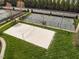 Overhead shot of a sand volleyball court and a multi-use sports court in the community at 1055 Kerr St, Burlington, NC 27215
