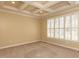 Cozy bedroom featuring plush carpeting, a coffered ceiling, plantation shutters and neutral paint at 106 White Deer Trl, Garner, NC 27529