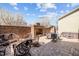Private backyard features a brick fireplace, patio, outdoor seating, and flowering trees at 1086 Tender Dr, Apex, NC 27502