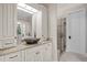 A stylish bathroom featuring a vessel sink, granite countertops, custom cabinets, and glass shower at 1086 Tender Dr, Apex, NC 27502