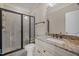 Bathroom with granite countertops, a tiled shower, and a glass door at 1086 Tender Dr, Apex, NC 27502