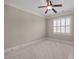 Carpeted bedroom with window offering natural light and privacy at 1086 Tender Dr, Apex, NC 27502