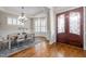 Elegant dining room featuring hardwood floors, stylish chandelier, and beautiful trim work at 1086 Tender Dr, Apex, NC 27502