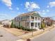 Corner lot showcasing a charming two-story home with double porches and manicured landscaping at 1086 Tender Dr, Apex, NC 27502