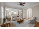 Inviting living room featuring an open floor plan, comfortable seating, and seamless flow to the kitchen at 1086 Tender Dr, Apex, NC 27502