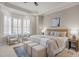 Spacious main bedroom features a bay window, sitting area, tray ceiling, and neutral color palette at 1086 Tender Dr, Apex, NC 27502