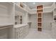 A walk-in closet with custom shelving, drawers, and ample storage space to organize your wardrobe at 1086 Tender Dr, Apex, NC 27502