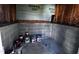 Unfinished basement with gray concrete block, perfect for storage or future expansion at 1104 Thelonious Dr, Raleigh, NC 27610