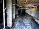 Spacious unfinished basement featuring vapor barrier and support columns at 1104 Thelonious Dr, Raleigh, NC 27610