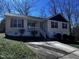Charming one-story home featuring a quaint front porch and driveway at 1104 Thelonious Dr, Raleigh, NC 27610