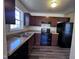 Efficient kitchen equipped with modern appliances and wooden cabinets at 1104 Thelonious Dr, Raleigh, NC 27610