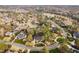 A picturesque aerial view of a residential community with golf course, lush landscaping, and winding roads at 112 Trellingwood Dr, Morrisville, NC 27560