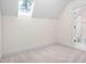 Attic bedroom with a bright skylight and en-suite bathroom at 112 Trellingwood Dr, Morrisville, NC 27560