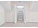 A bright bedroom has an open closet with shelving at 112 Trellingwood Dr, Morrisville, NC 27560