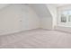 Bright bedroom with carpet, features a window seat, and a door at 112 Trellingwood Dr, Morrisville, NC 27560