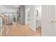 Inviting hallway featuring hardwood floors with views to the living spaces at 112 Trellingwood Dr, Morrisville, NC 27560